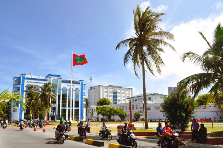 Motorists driving past public square in Maldives
